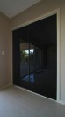 Frameless Sliding Wardrobe Doors Black Glass Finish